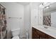 Well-lit bathroom features a vanity with a dark wood cabinet and neutral decor at 2821 Casona Way, Raleigh, NC 27616