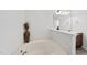 Bathroom featuring a soaking tub with a decorative vase adding a touch of elegance at 2821 Casona Way, Raleigh, NC 27616