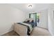 Cozy bedroom featuring a neutral bed frame, colorful bedding, and natural light at 2821 Casona Way, Raleigh, NC 27616