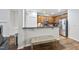 Modern kitchen with dark wood cabinets, breakfast bar, and stainless steel appliances at 2821 Casona Way, Raleigh, NC 27616