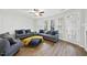 Comfortable living room with a ceiling fan, a cozy seating arrangement, and ample natural light at 2821 Casona Way, Raleigh, NC 27616