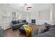 Inviting living room with a fireplace, comfortable seating, and bright natural light at 2821 Casona Way, Raleigh, NC 27616