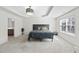 Main bedroom with tray ceilings, carpet, and a window providing natural light at 2821 Casona Way, Raleigh, NC 27616