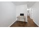 Bright office space features wood floors and a modern desk with a computer at 2821 Casona Way, Raleigh, NC 27616