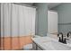 Bathroom with speckled vanity, colorful shower curtain and tile flooring at 3080 Colony Rd # A, Durham, NC 27705