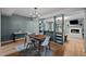 Open-concept dining and living area with stylish decor and modern lighting at 3080 Colony Rd # A, Durham, NC 27705