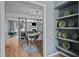 A dining room view showcasing modern lighting, stylish decor, and a peek into living area at 3080 Colony Rd # A, Durham, NC 27705