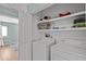 Laundry room with washer, dryer, and plenty of storage shelves at 3080 Colony Rd # A, Durham, NC 27705