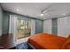 Main bedroom with sliding glass doors, ceiling fan, and lots of closet space at 3080 Colony Rd # A, Durham, NC 27705