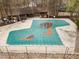 Outdoor pool featuring a green cover in a community setting with a clubhouse nearby at 3080 Colony Rd # A, Durham, NC 27705