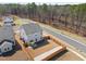 Aerial view of a home with a fenced backyard and proximity to a quiet, wooded area at 3103 Woodland Park Rd, Durham, NC 27703