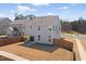 Spacious fenced backyard with a patio area, perfect for outdoor dining and entertaining at 3103 Woodland Park Rd, Durham, NC 27703