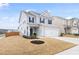 Charming home with light gray siding, black shutters, well-maintained lawn, and adjacent home at 3103 Woodland Park Rd, Durham, NC 27703