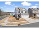 Charming two-story home with a two-car garage, well-maintained lawn, and manicured landscaping at 3103 Woodland Park Rd, Durham, NC 27703