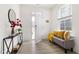Bright foyer featuring wood floors, console table, mirror, bench, and natural light at 3103 Woodland Park Rd, Durham, NC 27703