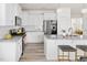 Well-appointed kitchen features stainless appliances, granite counters, island seating, and stylish finishes at 3103 Woodland Park Rd, Durham, NC 27703