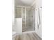 Contemporary shower with a glass door and tile surround at 3103 Woodland Park Rd, Durham, NC 27703