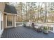 This deck is ready to enjoy with outdoor seating, table, and potted plants at 315 Barthel Dr, Cary, NC 27513