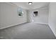 This bedroom offers plenty of natural light from the two windows and neutral carpeting throughout at 317 Gary St, Raleigh, NC 27606