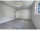 Carpeted bedroom with closet and light-filled window creating a welcoming atmosphere at 317 Gary St, Raleigh, NC 27606