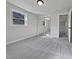 A bedroom boasts mirrored closet doors and a bright window for ample light at 317 Gary St, Raleigh, NC 27606