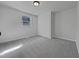 This carpeted bedroom features a closet and large window, offering a serene and functional space at 317 Gary St, Raleigh, NC 27606