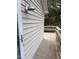 Exterior view of a wooden walkway with a white house and outdoor lighting at 3329 Bearskin Ct, Raleigh, NC 27606