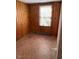 Bedroom featuring wood paneling and mosaic tile at 333 Leasburg Rd, Roxboro, NC 27573
