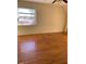 Hardwood floors and ample natural light enhance this bedroom space with a dormer window at 333 Leasburg Rd, Roxboro, NC 27573