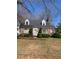Charming brick home featuring a well-maintained front yard and classic architectural details at 333 Leasburg Rd, Roxboro, NC 27573