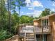 Wooden deck on the back of a brick house, perfect for outdoor relaxation at 3605 Octavia St, Raleigh, NC 27606