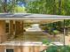Covered back porch of the brick home, perfect for outdoor relaxation at 3605 Octavia St, Raleigh, NC 27606