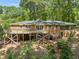 Brick home with a large wooden deck overlooking the backyard at 3605 Octavia St, Raleigh, NC 27606