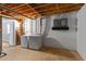 Unfinished basement laundry area features washer, dryer and exposed ceiling at 3605 Octavia St, Raleigh, NC 27606