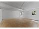 Clean unfinished basement featuring concrete flooring, white-washed walls, and ample space at 3605 Octavia St, Raleigh, NC 27606