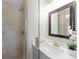Contemporary bathroom featuring a walk-in shower with glass door, stylish vanity, and modern fixtures at 3605 Octavia St, Raleigh, NC 27606