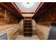 Beautifully crafted cedar closet featuring wooden shelves and paneling, perfect for storage at 3605 Octavia St, Raleigh, NC 27606