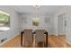 Inviting dining room with hardwood floors, neutral walls, and a table set for a pleasant meal at 3605 Octavia St, Raleigh, NC 27606