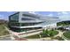 Modern building with large glass windows and landscaping, showcasing architectural design and inviting atmosphere at 3605 Octavia St, Raleigh, NC 27606