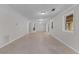 Spacious living room with wainscotting, recessed lighting, fireplace and windows to the backyard at 3605 Octavia St, Raleigh, NC 27606