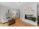 Cozy living room with fireplace, hardwood floors, and tasteful decor at 3605 Octavia St, Raleigh, NC 27606