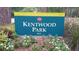 Kentwood Park sign with lush landscaping and colorful flowers, inviting visitors to enjoy the park's amenities at 3605 Octavia St, Raleigh, NC 27606