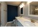 Bathroom featuring double sinks, white cabinets, and modern fixtures at 372 White Oak Ridge Dr, Garner, NC 27529