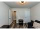 A cozy bedroom features hardwood floors, a small table, and bright lighting at 372 White Oak Ridge Dr, Garner, NC 27529