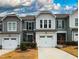 Charming townhome featuring a one-car garage and manicured landscaping at 372 White Oak Ridge Dr, Garner, NC 27529