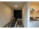 Hallway with hardwood floors leading to the laundry room with appliances and a wire shelf at 372 White Oak Ridge Dr, Garner, NC 27529