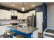Stylish kitchen featuring white cabinetry, granite countertops, and stainless steel appliances at 372 White Oak Ridge Dr, Garner, NC 27529