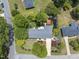 Aerial view of landscaped property showcasing the house and surrounding greenery and neighborhood at 401 Fletcher Dr, Raleigh, NC 27603