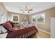 Bedroom with windows providing exterior views of the property and a ceiling fan at 401 Fletcher Dr, Raleigh, NC 27603