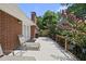 Back deck with brick chimney and lush green trees in the background at 401 Fletcher Dr, Raleigh, NC 27603
